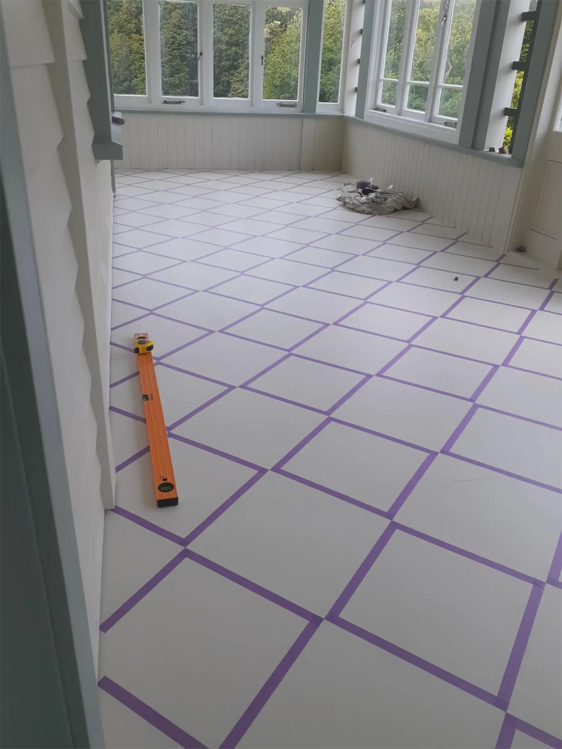 Floor with a purple masking tape diamond pattern