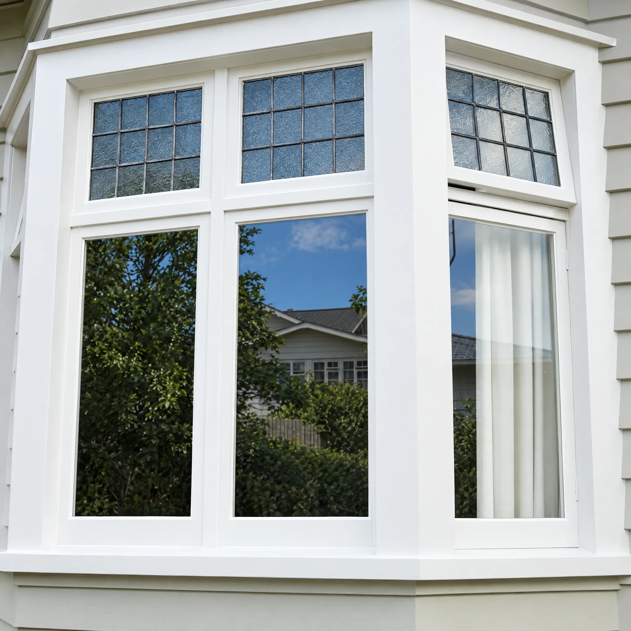 Timber bay window with leadlight top lights